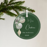 Green gold white baubles Christmas Glass Ornament<br><div class="desc">A green colored background. Decorated with white and gold baubles and some greenery and a pine cone.  Personalize and add your name,  year.  Text: Merry Christmas</div>