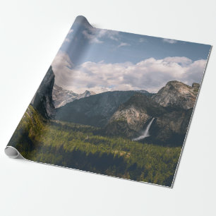 GREEN GRASS FIELD NEAR ROCKY MOUNTAIN UNDER WHITE WRAPPING PAPER