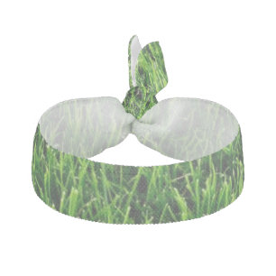 Green grass texture from a soccer field ribbon hair tie