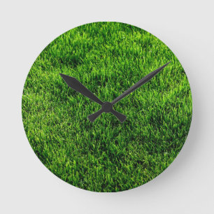 Green grass texture from a soccer field round clock