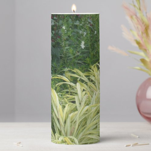 Green grasses among the forest trees pillar candle
