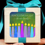 Green Hanukkah Blue Boho Candles Peace Love Light Square Sticker<br><div class="desc">“Peace, love & light.” A playful, modern, artsy illustration of boho pattern candles helps you usher in the holiday of Hanukkah. Assorted blue candles with colorful faux foil patterns overlay a rich, deep green textured background. Feel the warmth and joy of the holiday season whenever you use this stunning, colorful,...</div>