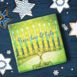 Green Hanukkah Menorah Peace Love Light Script Stone Coaster<br><div class="desc">“Peace, love & light.” A close-up photo of a bright, colorful, green and yellow artsy menorah helps you usher in the holiday of Hanukkah in style. Feel the warmth and joy of the holiday season whenever you relax with your favorite beverage on this stunning, colorful Hanukkah stone coaster. Makes a...</div>