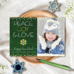 Green Hanukkah Peace Joy Love Snowflake Photo Bold Holiday Card<br><div class="desc">“Peace, joy & love.” A fun, playful, gold foil and white snowflake illustration and modern typography on a rich, deep dark green marble watercolor background help you usher in the Hanukkah season, along with the custom photo of your choice. Faux gold foil and white confetti dots frame the card. Feel...</div>