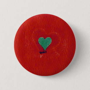 Green heart on a red grunge background button