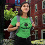 Green High School Graduate Personalized Graduation T-Shirt<br><div class="desc">This kelly green custom senior graduate t-shirt features classy white typography of your high school or college name for the class of 2025. Customize with your graduating year under the chic black handwritten script and black grad cap for a great personalized light green graduation tee for a party or keepsake...</div>