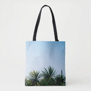 Green leaf plants under clear sky tote bag