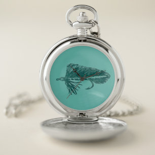 Green matuka streamer, fly tying and fishing pocket watch