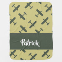 Green military airplane on brown baby blanket
