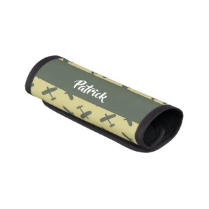 Green military airplane on brown luggage handle wrap