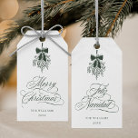 Green Mistletoe Merry Christmas | Feliz Navidad    Gift Tags<br><div class="desc">This holiday gift tag features elegant,  romantic swirly calligraphy with a winter mistletoe bouquet and a festive 'Merry Christmas' on the front,  along with 'Feliz Navidad' script on the back. For more advanced customization of this design,  please click the BLUE DESIGN TOOL BUTTON above!</div>