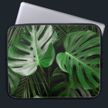 Green monstera leaves and palm leaves laptop sleeve<br><div class="desc">Green monstera leaves and palm leaves</div>