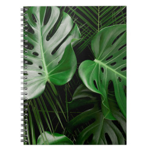 Green monstera leaves and palm leaves notebook