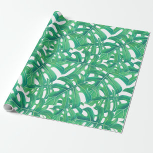 Green monstera tropical leaves pattern on white b wrapping paper