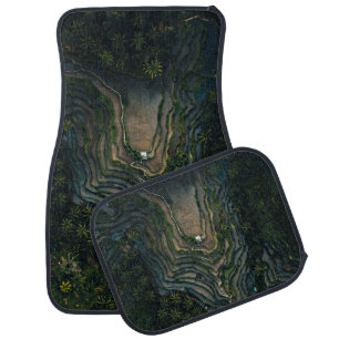 Green moss on black rock car floor mat