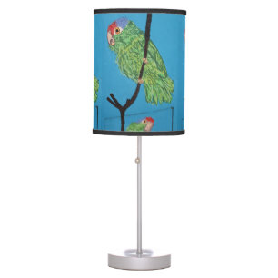 green parrot on blue table lamp