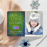 Green Photo Hanukkah Menorah Peace Love Light Type Holiday Card<br><div class="desc">“Peace, love & light.” A playful, modern, artsy illustration of boho pattern candles in a menorah helps you usher in the holiday of Hanukkah, along with the custom photo of your choice. Assorted blue candles with colorful faux foil patterns overlay a rich, deep green blue textured background. Faux gold foil...</div>