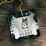 Green Plaid Rustic Pine Trees Dog Bone Pet Photo Ceramic Ornament<br><div class="desc">Rustic farm fresh Christmas trees pet photo keepsake ornament. The ornament can be customized with the pet's name,  the year,  and the photo. green checkerboard plaid background with rustic pine trees and snowflakes. The pet's name is displayed on a white dog bone. Artwork by Moodthology Papery.</div>