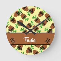 Green plant in terracotta pot on yellow round clock