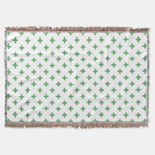 Green polka crosses on white throw blanket