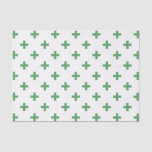 Green polka crosses on white tissue paper