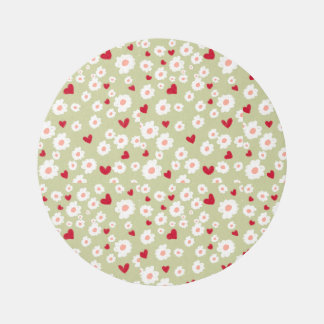 Green round rug with white work and