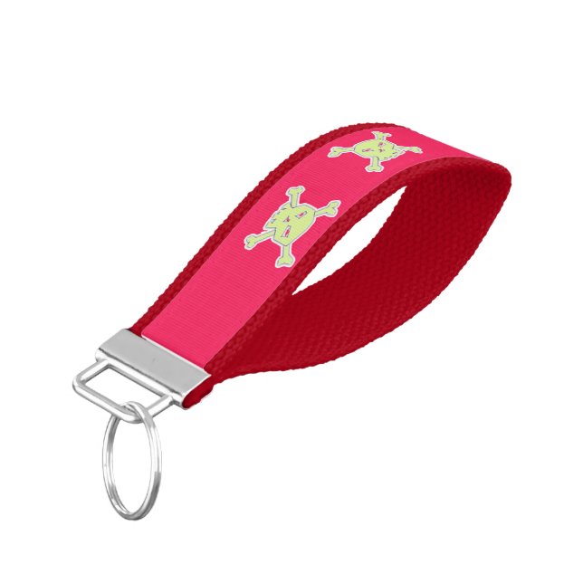 Green skull and bones on pink wrist keychain (Angled Down)