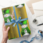 Green Snowman on Gold Christmas Wrapping Paper<br><div class="desc">A very festive golden Christmas wrapping paper featuring a whimsical pattern of snowmen clad in green velvet,  wearing top hat and vest with golden stars and green ribbons all set on a beautiful golden background,  to add a cute,  colorful and joyful touch to your gifts this year.</div>