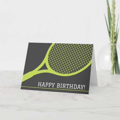 Green tennis racket on gray happy birthday card