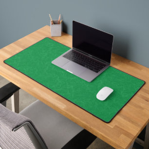 Green textured surface with  swirling pattern desk mat