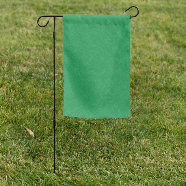 Green textured surface with  swirling pattern garden flag (In SItu)