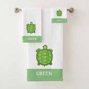 Green tortoise on white and lime green bath towel