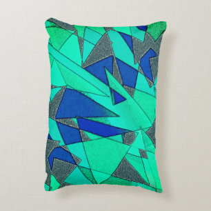 Green triangular cutouts on blue background, rough accent pillow
