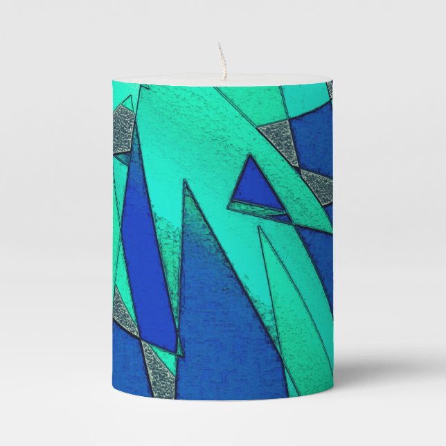 Green triangular cutouts on blue background, rough pillar candle (Front)