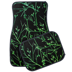 Green Twigs on Black Car Floor Mat