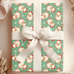 Green Vintage Santa Claus Face Watercolor Wrapping Paper<br><div class="desc">Wrap your gifts in festive cheer with our Green Vintage Santa Claus Face Watercolor Wrapping Paper! This charming design features nostalgic watercolor illustrations of Santa Claus faces set against a vibrant background, adorned with delicate snowflakes. Perfect for adding a touch of vintage charm to your holiday presents, this wrapping paper...</div>