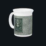 Green Woman - Stone Beverage Pitcher<br><div class="desc">A Green Woman carved in stone. Also known as a foliate head, the Green Man/Wild Man, is a motif in architecture and art, a face composed of, or completely surrounded by, foliage, most often spreading out from the center of the face. Apart from a purely decorative function, the Green Man...</div>