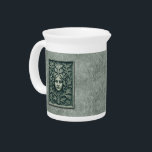 Green Woman - Stone Beverage Pitcher<br><div class="desc">A Green Woman carved in stone. Also known as a foliate head, the Green Man/Wild Man, is a motif in architecture and art, a face composed of, or completely surrounded by, foliage, most often spreading out from the center of the face. Apart from a purely decorative function, the Green Man...</div>