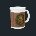 Green Woman - Wood Beverage Pitcher<br><div class="desc">A Green Woman carved in wood with paint applied to the oak leaves and hair. Customize by adding your own text on the reverse side. Also known as a foliate head, the Green Man/Wild Man, is a motif in architecture and art, a face composed of, or completely surrounded by, foliage,...</div>