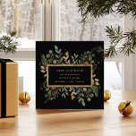 Greenery on Black | Christmas Holiday Photo Save The Date<br><div class="desc">This stunning Christmas wedding save the date features holiday greenery and leaves with faux gold leaves and red holly berries,  and a center gold frame on a modern black background. Your personal photo goes on the back,  surrounded by another gold geometric frame with winter greenery.</div>