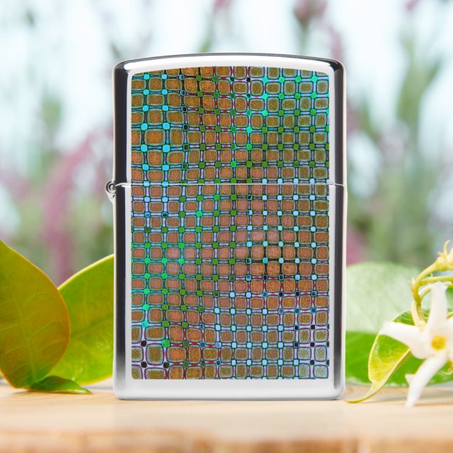 Greenish mizzle spots under grid rustic antiquated zippo lighter (On Table)