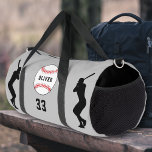 Grey Baseball Ball Player Silhouette Name Number Duffle Bag<br><div class="desc">Grey Baseball Ball Player Silhouette Name Number Duffle Bag. Silhouette of baseball players and baseball ball with custom name on a red background. Personalize with player's name and number or erase the text.</div>