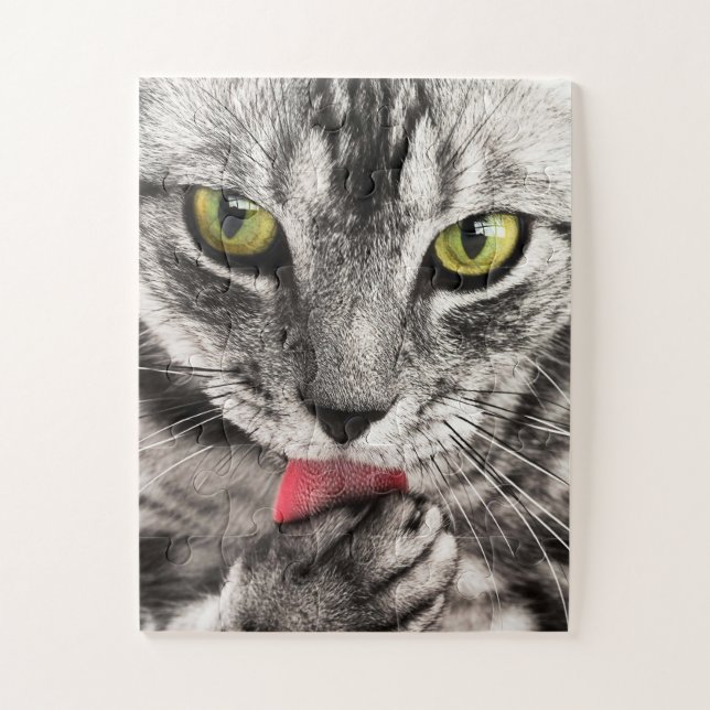 Grey Cat with Yellow Eyes Licking Paw Jigsaw Puzzle (Vertical)