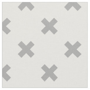 Grey cross stitches on white fabric