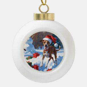 Greyhound Running in Snow with Christmas Hat Ceramic Ball Christmas Ornament