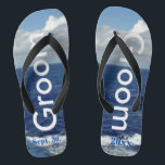 Groom Ocean Waves Blue Sky Flip Flops<br><div class="desc">One-of-a-kind Groom flip flops custom designed. Pretty Blue Sky with Fluffy White Clouds, Blue Sea and White Foam Ocean Waves. Unisex Flip Flops with Groom written in light silver text, and Date of Marriage in blue text. PERSONALIZE with your Wedding DATE (or delete text). Shown with Wide Black Straps and...</div>
