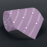 Groomsman Repeating White Text on Lavender Neck Tie<br><div class="desc">This fun neck tie is the perfect accessory for the groomsmen at your wedding. It features a simple yet elegant design with the word "groomsman" written in fancy all capital white text repeating in a diagonal pattern on a light purple or lavender colored background. Perfect way to add a bit...</div>