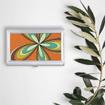 Groovy 60s 70s Hippie Flower Orange Retro Daisy Case For Business Cards<br><div class="desc">This orange, retro design boasts a kaleidoscope of warm, earthy tones that epitomize the essence of the ‘60s and ‘70s, inviting you to the world that’s nothing short of groovy. It features a hypnotic, flower-inspired motif that radiates outward in a dazzling display of oranges, yellows, and greens, turquoises reminiscent of...</div>