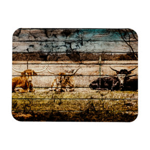 Group of Longhorns Laying in Field Distressed Wood Magnet
