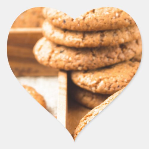 Group of oatmeal cookies on the wooden tray heart sticker